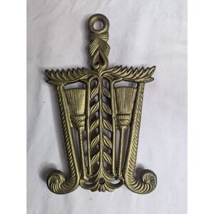 Vintage Grain & Tassel T-6 gold color trivet with brooms and handle